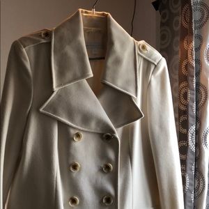 Cream colored double breasted coat